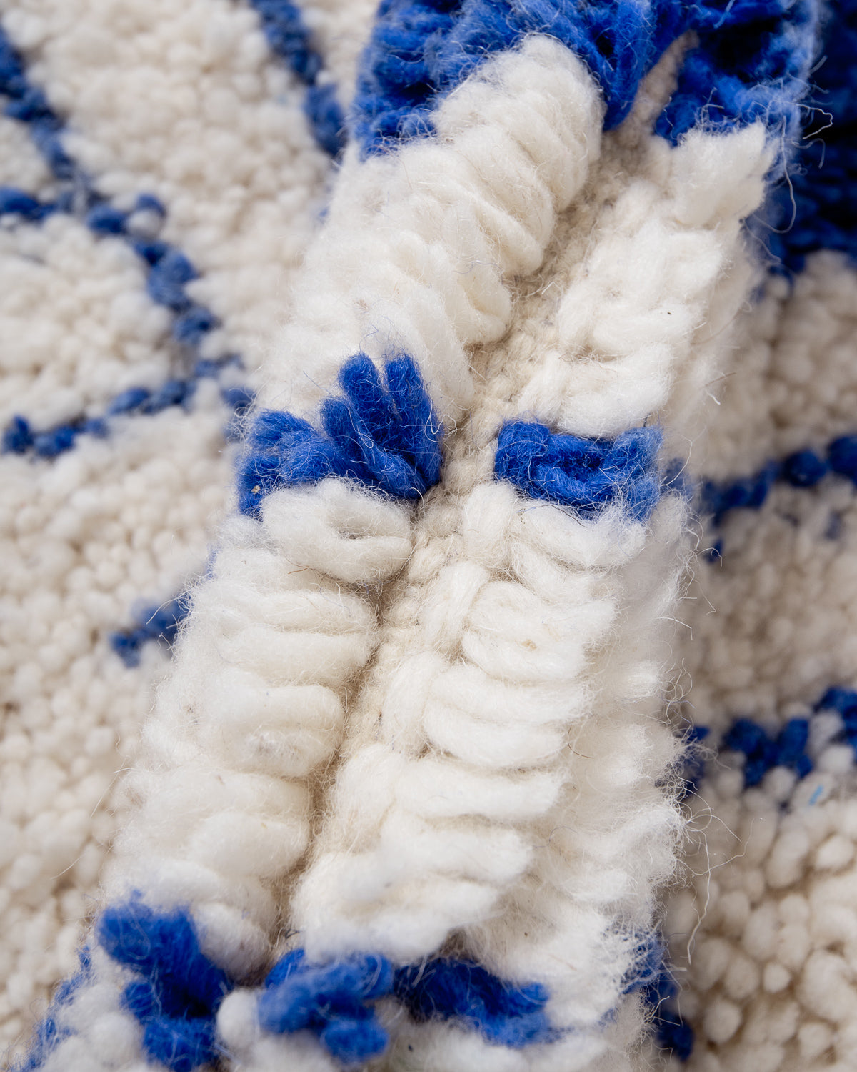 Modern, designer, handcrafted Berber rug from Morocco. Beniourain carpet with beautiful colours and patterns and fluffy wool texture.